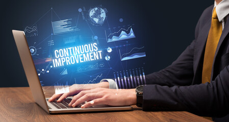 Businessman working on laptop, business concept