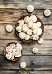 Pieces of fresh mushrooms in bowl.