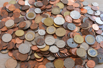 A pile of coins from around the world.