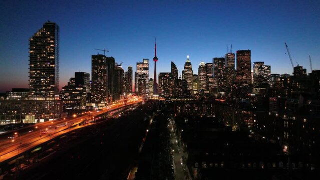 Aerial cinematic downtown Toronto QEW lakeshore sunset financial district 1