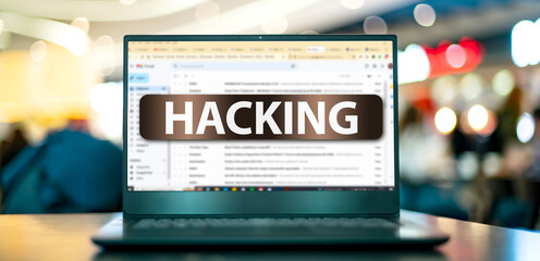 Laptop displaying the sign of hacking on the internet