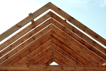 A timber roof truss of a house under construction
