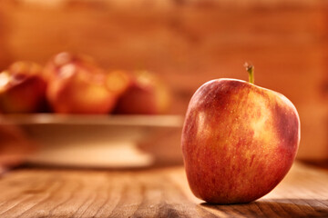 Red apple on wooden table