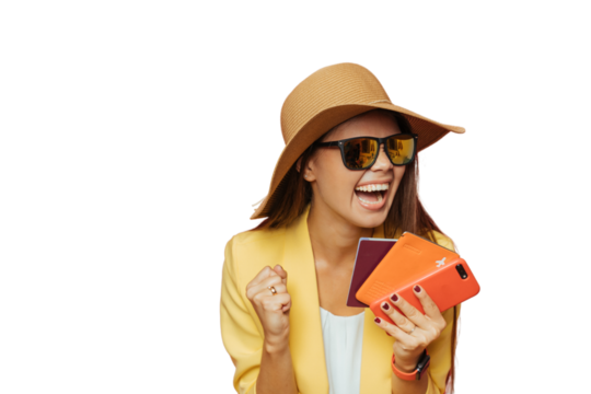 Young girl with broad smile in straw hat,  yellow jacket happy that she is going to travel, holding passport and smartphone. Travel people concept. Excited Italian girl against transparent background.