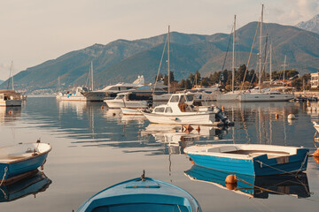 Beautiful winter Mediterranean landscape. Montenegro, Tivat. View of Bay of Kotor. Fishing boats, yachts  and sailboats on water