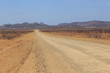 Fototapeta na wymiar Namibian landscape along the gravel road. Damaraland, homelands in South West Africa, Namibia.