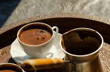 Traditional tray of Arabic or Turkish style coffee, a drink popular in the Middle East, Turkey and...