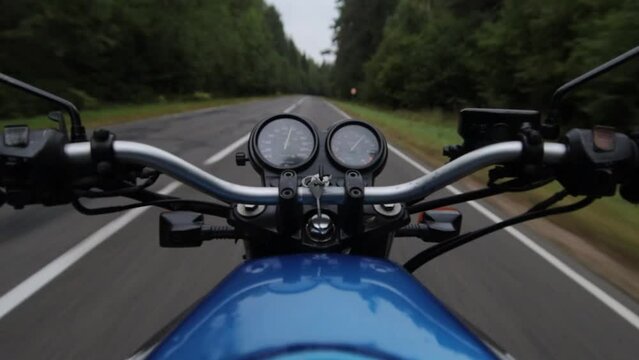 motorbike riding on forest road, first person motorcyclist journey.