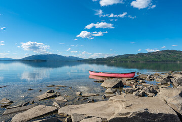 Sweeping panoramic views of wilderness area in Yukon Territory, Canada during summer with red...
