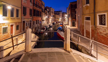 Venice. Old colorful houses over the canal in the early morning.