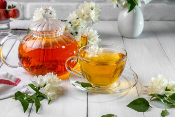 Jasmine tea in a cup on a wooden background