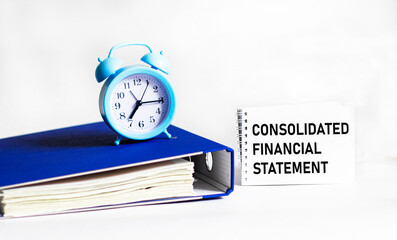 Notepad with message about consolidated financial statements. Conceptual image