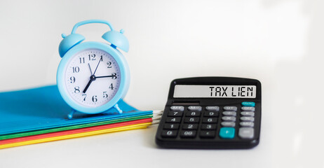 TAX LIEN. white background text on calculator display