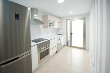 modern kitchen decorated with white appliances