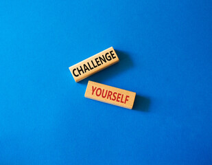 Challenge yourself symbol. Wooden blocks with words Challenge yourself. Beautiful blue background. Business and Challenge yourself concept. Copy space.