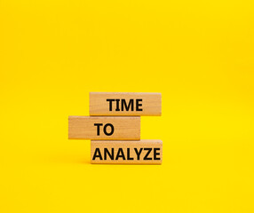 Time to Analyze symbol. Concept word Time to Analyze on wooden blocks. Beautiful yellow background. Business and Time to Analyze concept. Copy space