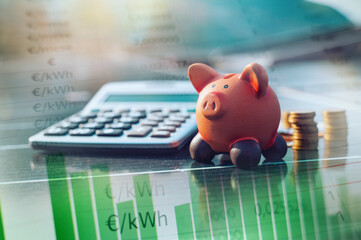 Piggybank on solar panel concept of money saved by using clean energy