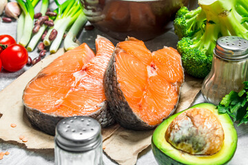 Organic food. Raw salmon fish with healthy food.