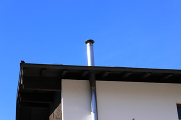 new stainless steel chimney on a house	