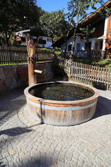 Fototapeta premium a wooden well with an old water pump