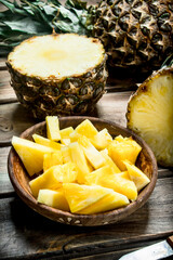 Pieces of ripe pineapple in a bowl.