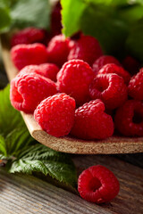 Fresh raspberries with leaves.