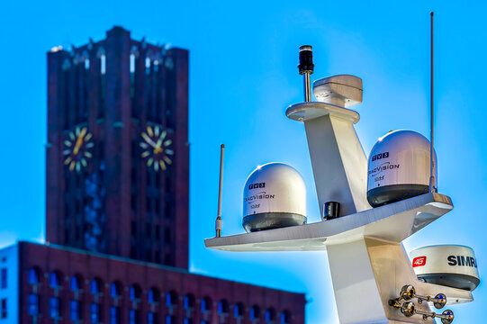Berlin, Germany - March 8, 2022: Satellite equipment on the roof of a yacht against the light with the Berlin Ullsteinhaus in the background.