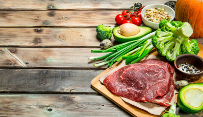 Healthy food. Variety of organic food with raw beef meat.