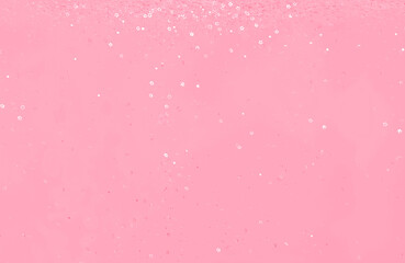 Falling shiny star shaped confetti toned in trendy magenta color of year 2023.