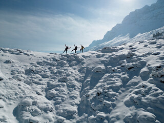 strong team performing successful climbing and hiking in the summit mountains