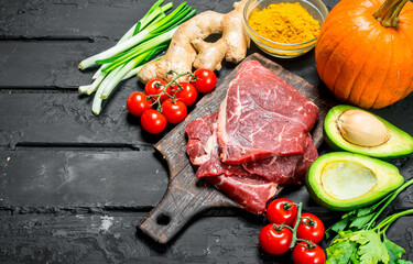 Healthy food. Organic food assortment with raw beef steaks .