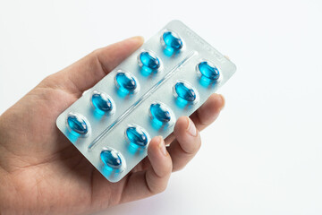 Blue pills for pain, dispensing medical pills, health and treatment