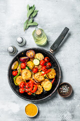 Assortment of grilled vegetables with spices and herbs.