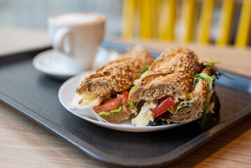 breakfast in the restaurant bread with filling sandwich with a cup of coffee