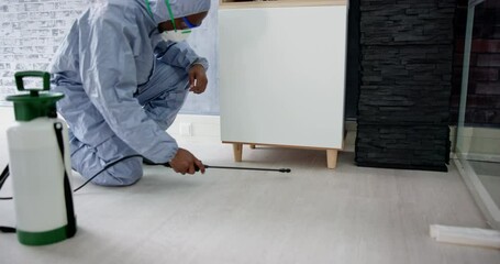 Pest Control Exterminator Man Spraying Termite Pesticide - Powered by Adobe
