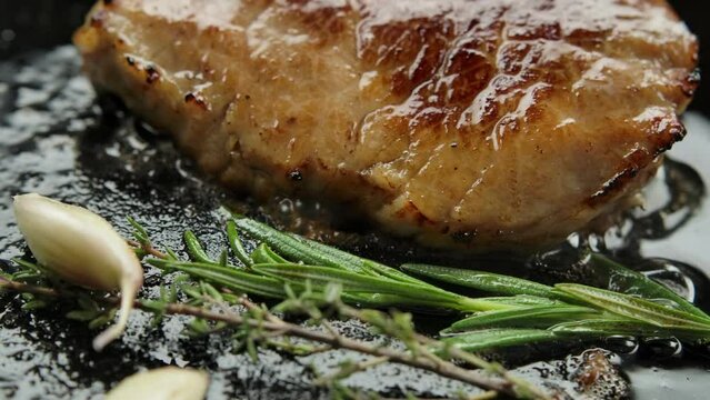 Panorama over hot pan with steak butter and garlic