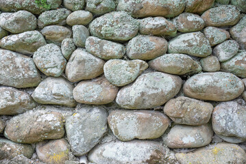 dry stone wall constructed from river stone 