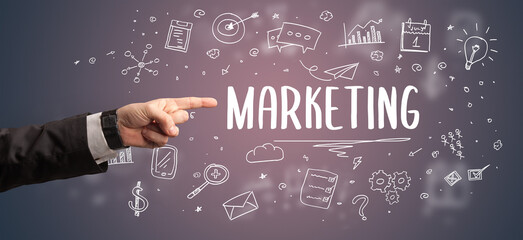 Close-Up of cropped hand pointing at business inscription