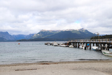 Boats on Port Villa La Angostura, Neuquen, Argentina. Patagonia. Lake Nahuel Huapi. Bay. Touristic city. Lanscape.