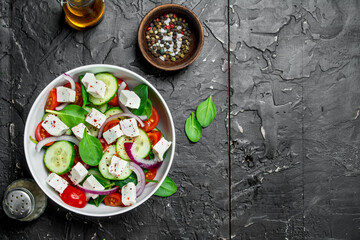 Vegetable salad. Salad with vegetables, cheese and olive oil.