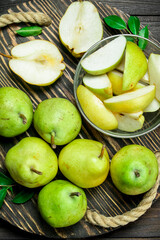 The pear slices in a bowl on the tray.