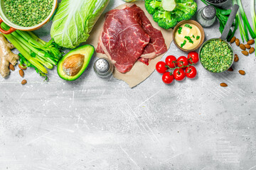 Organic food. Raw beef meat with healthy food.