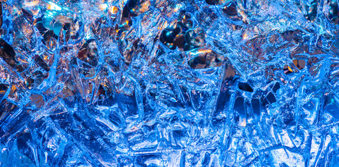 beautiful background with ice patterns on blue. ice silhouettes for desktop background. unusual natural silhouettes of frozen water. health medicine drinks ecology concept.