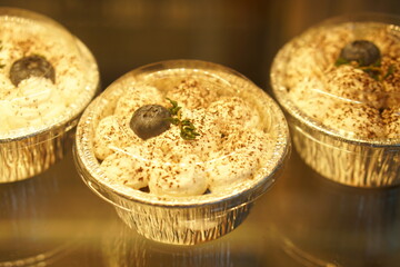 Cake in glass cabinet with orange lights