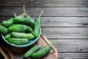 Cucumbers in a plate on a cutting Board.