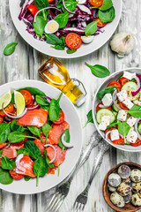 Various salads of organic vegetables, fish and cheese with olive oil and spices .