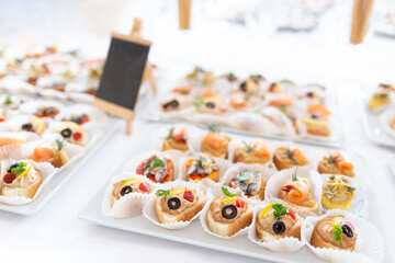 Close up of various canapes in plate.