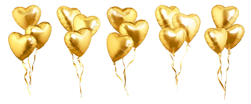 Flying golden heart shaped air balloons.