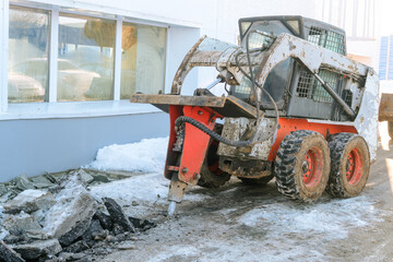 Hydraulic jack hammer on a skid steer loader breaker. Hydraulic attachments for the destruction of...