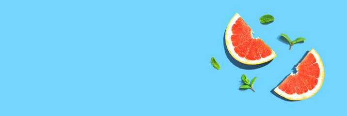 Fresh grapefruits and mints overhead view - flat lay